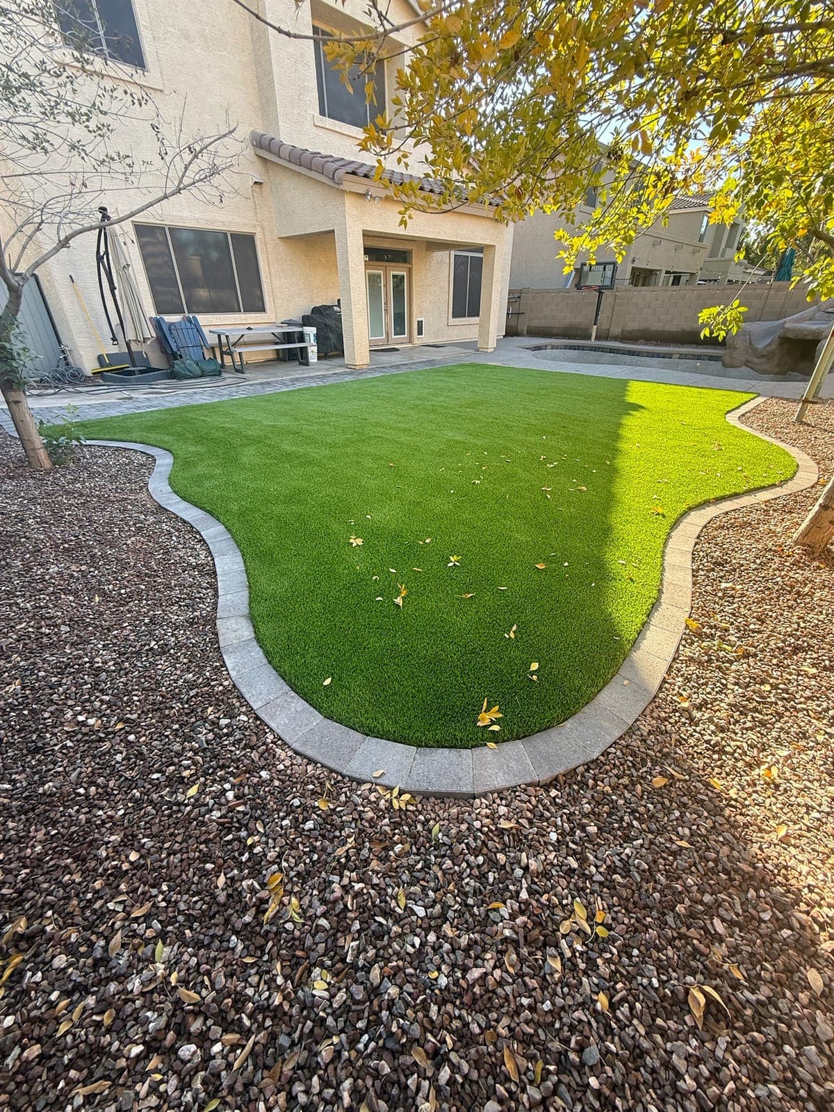 Paver pool deck and backyard hardscape in Chandler, Arizona