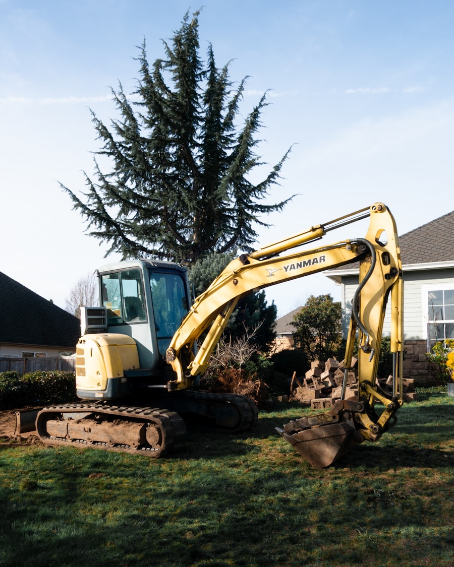 Excavator staged at a residential site before construction